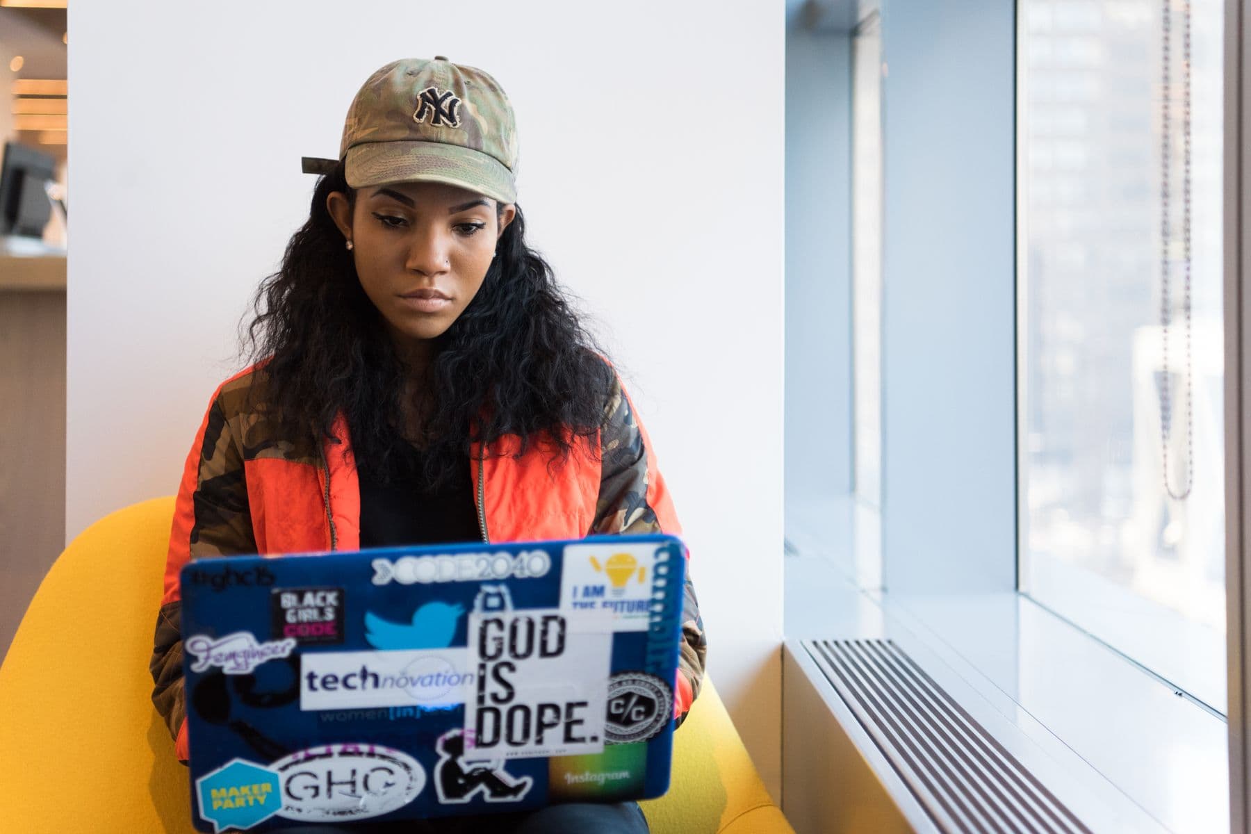 A product professional using analytics on a laptop in a modern workplace