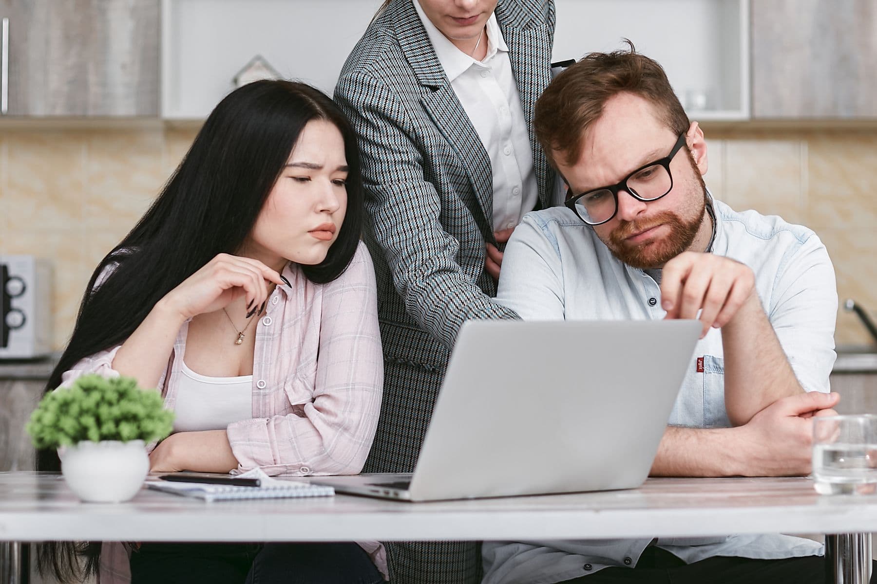 A product professional using analytics on a laptop in a modern workplace
